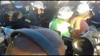 Jubilant workers emerge from underground after ending a nine-day sit-in at Rustenburg mine (8Fu)