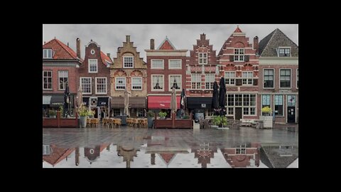 Rain on a large puddle by Statenplein in beautiful Dordrecht