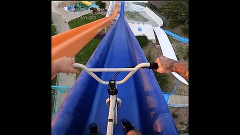 Adrenaline Rush: BMX Bike Takes on Water Park Slides (Against All Rules!)