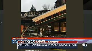 SPECIAL REPORT | Amtrak train car dangling over Washington interstate after derailment
