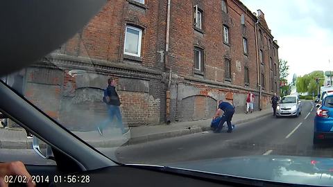 Dash Cam Captures Drunk Man Stumble And Fall Into Street
