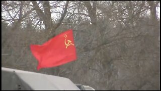 Russian Troops Fly Soviet Flag On Tank