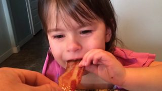 A Tot Girl Stops Crying When Her Dad Gives Her Bacon