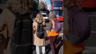 Commuters physically remove climate change protestors from the road