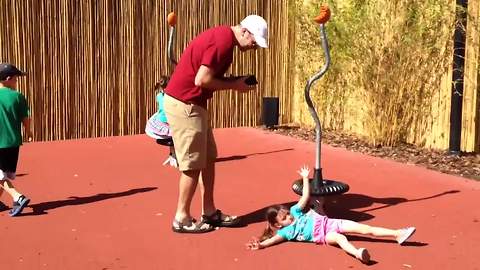 Girl Gets Dizzy On A Roundabout And Falls Before She Can Stand Up