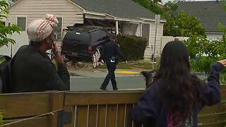 SUV crashes into Talmadge home