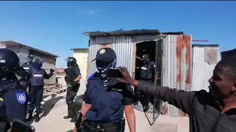WATCH: Cape Town enforcement officers violently eject naked man from shack (mvw)