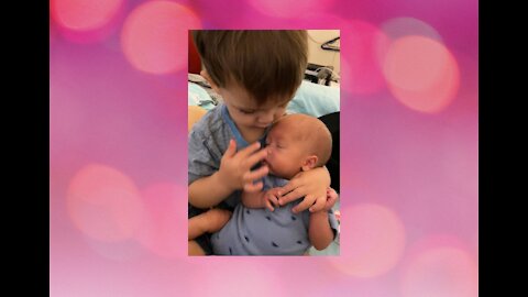 Toddler hilariously attempts to bottle feed baby brother cute