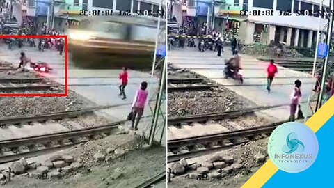 "Dramatic Railway Crossing Escape: Biker Narrowly Avoids Speeding Train in India" description