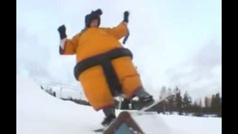 Professional snowboarders snowboard in sumo suits!