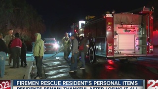 Firemen rescue resident''s personal items