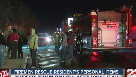 Firemen rescue resident''s personal items