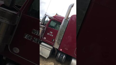 Semi truck hangs dangerously over the edge of a cliff
