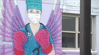 Denver artist honors health care workers fighting coronavirus with mural on East Colfax Avenue