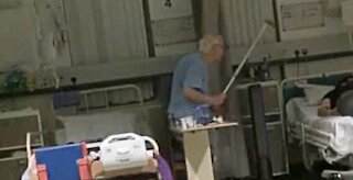 Elderly man hits patient in bed next to him with his cane