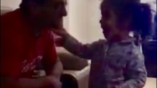 Adorable little girl sings to her Daddy