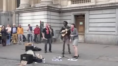 A random Lady Join the Reggae busker singing Three little Reggae