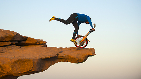 This Old Man Performs Clifftop BMX Yoga 300ft Above Ground