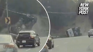 Dump truck completely flips over like a scene from an action movie