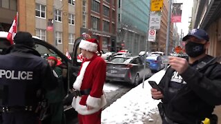Police harassment and intimidation of civil rights protestors increasing. Toronto Canada 2020-12-26
