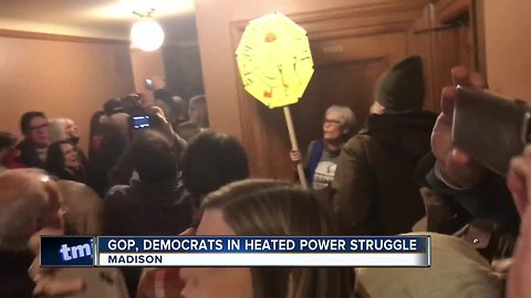 Protesters fight GOP's power-stripping plan during lame-duck session