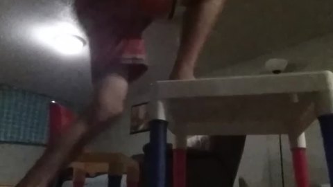 A Boy Climbs On A Toy Desk And It Breaks Under Him