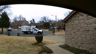 Surveillance video: Trash truck passes by full bins