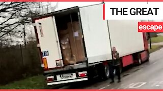 A group of men are seen running away after jumping out the back of a lorry