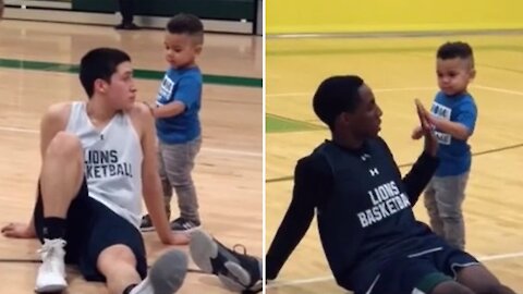 Coach's son does his part to get basketball team hyped