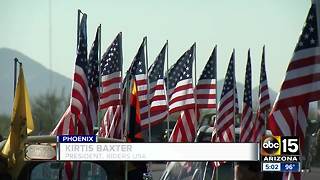 Valley group lines Veteran's National Memorial Cemetery entrance with hundreds of flags