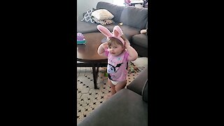 My daughter putting on bunny ears