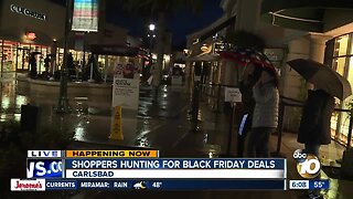 Shoppers brave the rain for the Black Friday deals
