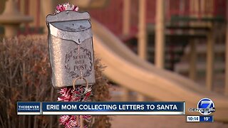 Woman in Erie collecting letters to Santa Claus with Christmas mailbox