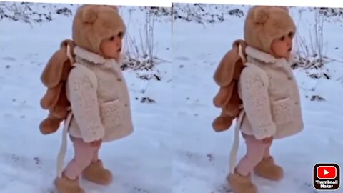 Baby dancing in a snow with music