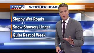 Snow showers linger Tuesday