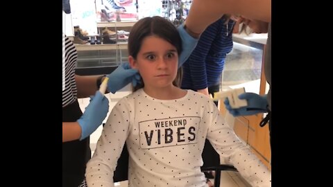 Kids getting their ears pierced for the first time.