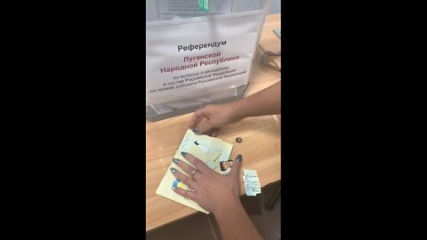 Woman destroys Ukrainian passport after voting for Lugansk region to join Russia