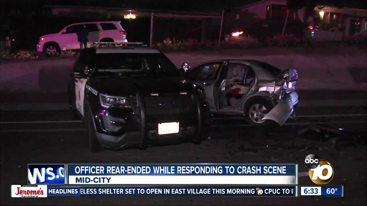 SDPD vehicle responding to crash hit by oncoming car
