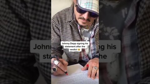 Johnny Depp signs his statement after the VERDICT #justiceforjohnnydepp