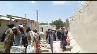 Prisoners Leaving Jail After Being Broken Out by Taliban