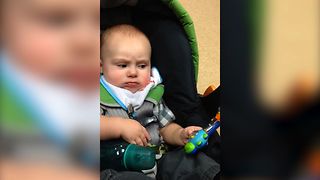 Grumpy Baby Not Amused By Toy