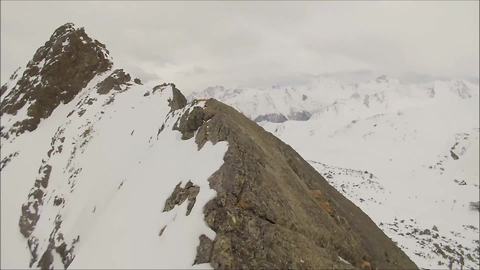 Daredevil risks life climbing mountain peak