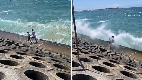 Reckless Beachgoers Get Wiped Out By Massive Wave