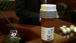 Recovering addicts react to locked prescription vial bill