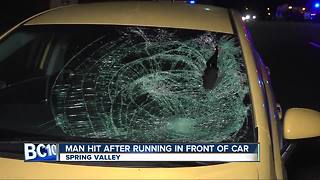 Man hit after running in front of car in Spring Valley