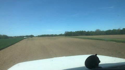 View from spreader truck of a mile long field