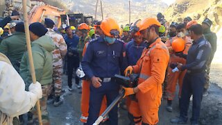 Indian Rescue Crews Work To Save Workers Trapped In Tunnel