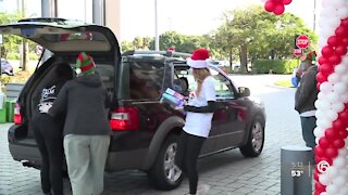 Volunteers with Boca Helping Hands serve Christmas Day feast