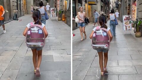 Little Girl Walks Around Barcelona With Bird On Her Head