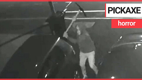 Dramatic CCTV shows yob swings pickaxe through roof of family car